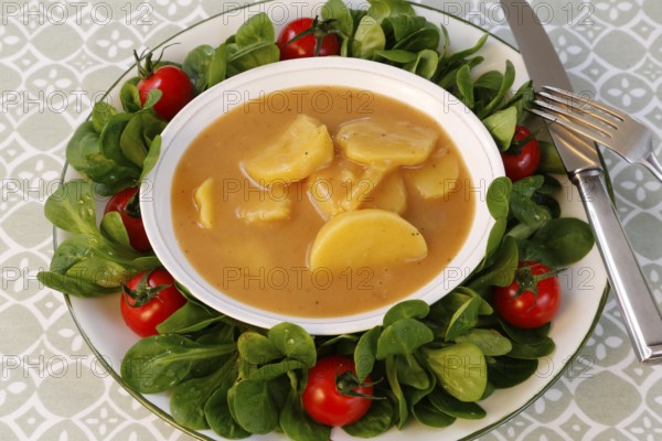 Swabian cuisine, sour potato wheels, potato slices in sour sauce, healthy cuisine, typical Swabian,