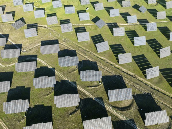 Rows of solar panels at a photovoltaic plant near town of Espejo. Aerial view. Drone shot. Córdoba