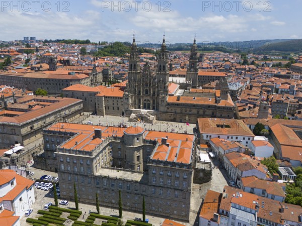The cathedral is at the centre of the cityscape, surrounded by several historic buildings with