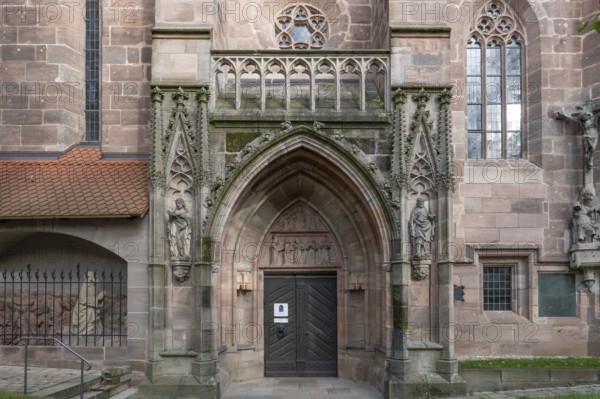 Main entrance portal of St Nicholas and St Ulrich Church, nave built around 1400, Kirchenberg 15,