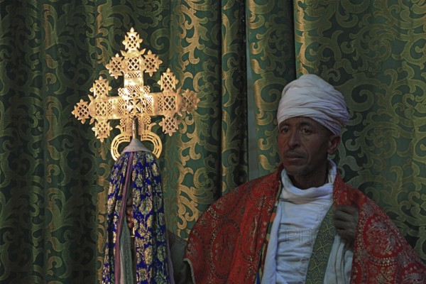 Lalibela, eastern group of rock-hewn churches, priest in the Bet Emmanuel, Emmanuel church,