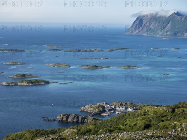 View from Mt. Sukkertoppen over coast at Hamn i Senja, marina of Hamn i Senja, Senja island,
