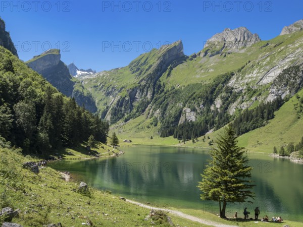 Lake Seealpsee, Alpstein mountain range near Wasserauen, peak of Mt. Säntis in the back, Appenzell,