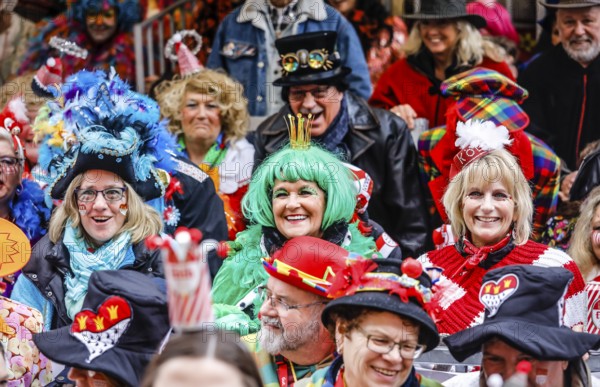 Colourfully costumed carnivalists celebrate carnival in Cologne, on Weiberfastnacht the street