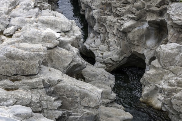 Rocks, granite rock formations in the Maggia River near Ponte Brolla, in the Maggia Valley, Valle