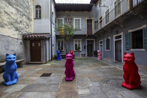 Cat figurines in a backyard of Cannobio, Lake Maggiore, Province of Verbano-Cusio-Ossola, Piedmont