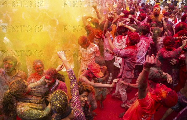 Revellers smear with Gulal or coloured powder and dance to play Holi, the Hindu spring festival of