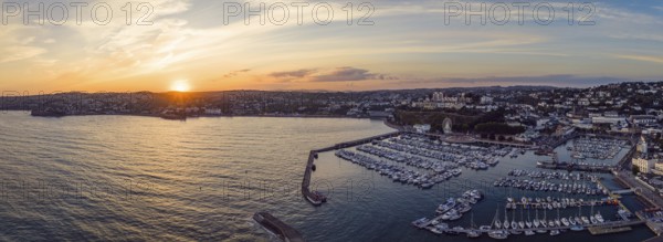 Sunset over Torquay Harbour and Marina, English Riviera from a drone, Devon, England, United