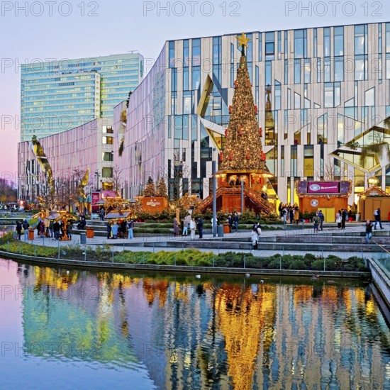 Dreischeibenhaus and Christmas market in front of the Koe-Bogen by architect Daniel Libeskind,