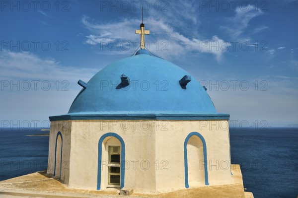 Blue church tower with sea view under a blue sky, Greek architecture, Church of Agios Georgios,
