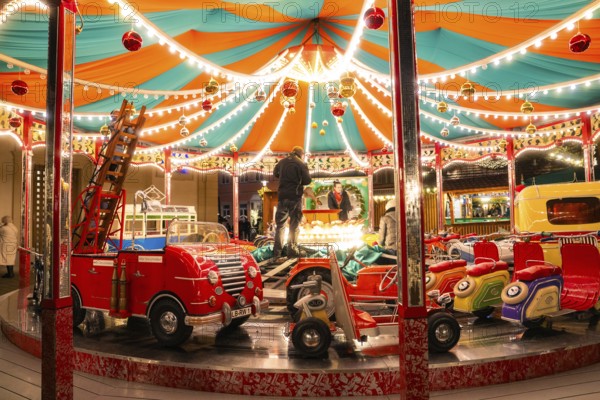 A colourful carousel with fairy lights in a lively night-time atmosphere, Ludwigsburg Christmas
