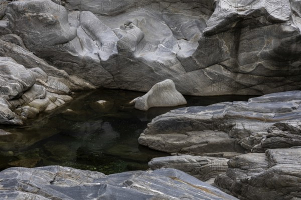 Rocks, granite rock formations in the Maggia River near Ponte Brolla, in the Maggia Valley, Valle