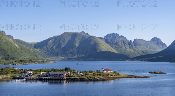 Place and small church Sildpollnes Kirke at the fjord Austnesfjorden, idyllic Norwegian fjord