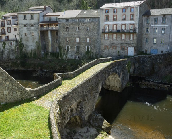 Olliergues village. Old bridge on river Dore. Natural regional park of Livradois Forez. Puy de Dome