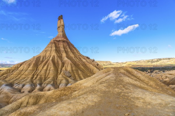 Majestic castildetierra rock formation rising from eroded hills in the bardenas reales desert under