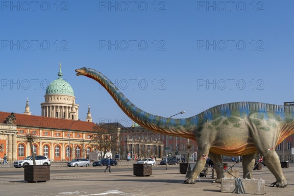 Large figure of a brontosaurus from a dinosaur exhibition in front of the film museum in the
