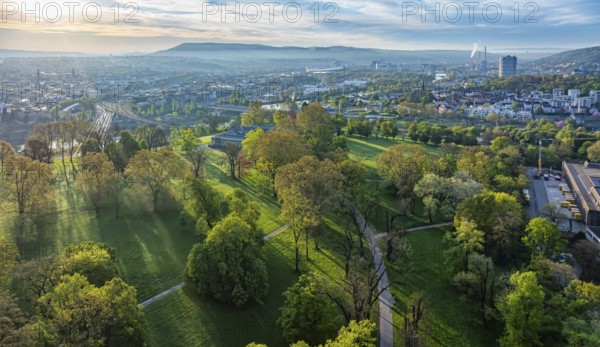 Rosensteinpark in the early morning, view of the cityscape of Bad Cannstatt. Aerial view.