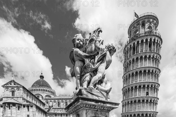 Statue with angels, behind the Cathedral of Santa Maria Assunta and the Leaning Tower, black and
