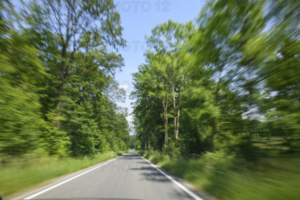 Symbolic image for speeding speeding dangerous driving at excessive speed by speeders on narrow
