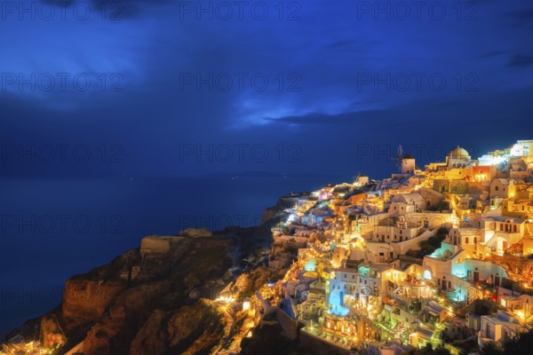 Famous greek iconic picturesque tourist destination Oia village with traditional white houses and