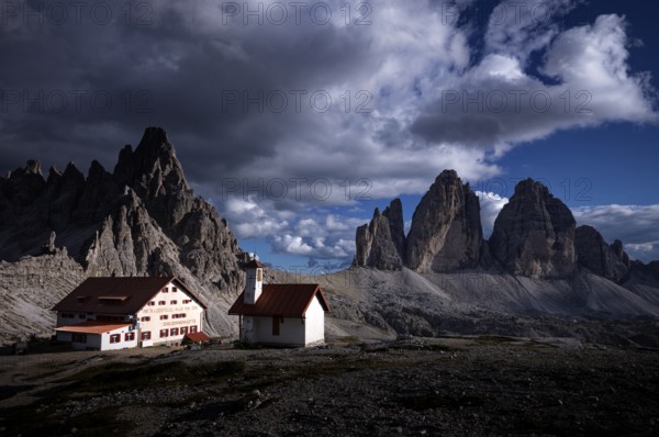 Stormy atmosphere, view of the Three Peaks Hut, chapel, Paternkofel, Three Peaks, South Tyrol,