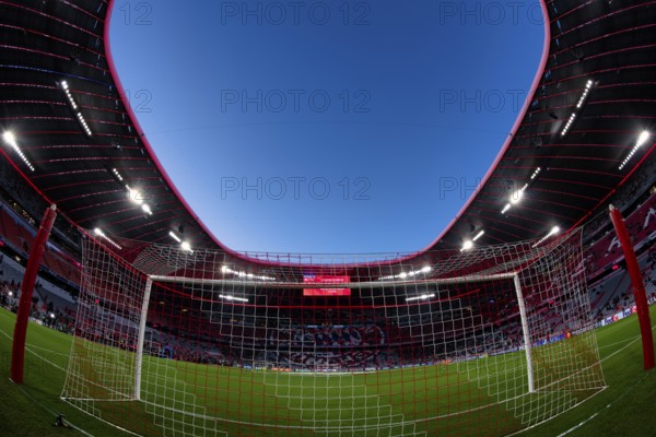 Overview, interior, floodlit match, behind-the-goal perspective, goal net, blue hour, fisheye shot,