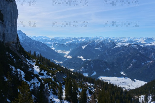 View of rugged mountains with snow and spruces, clear atmosphere, Steinplatte, Waidring, Tyrol,