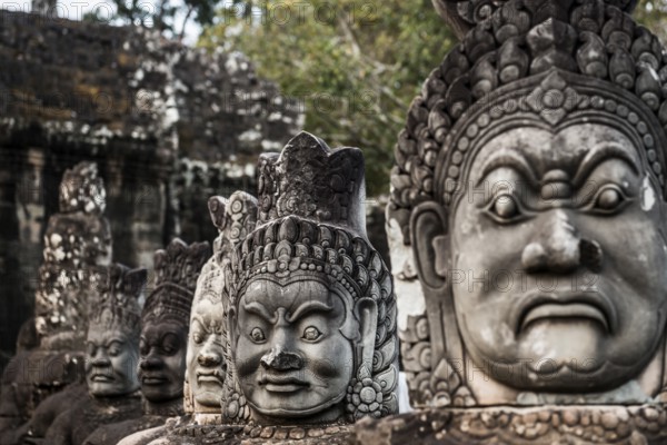 Figures on the bridge to Angkor Thom, sunset, Angkor Wat, Angkor, UNESCO World Heritage Site, Siem