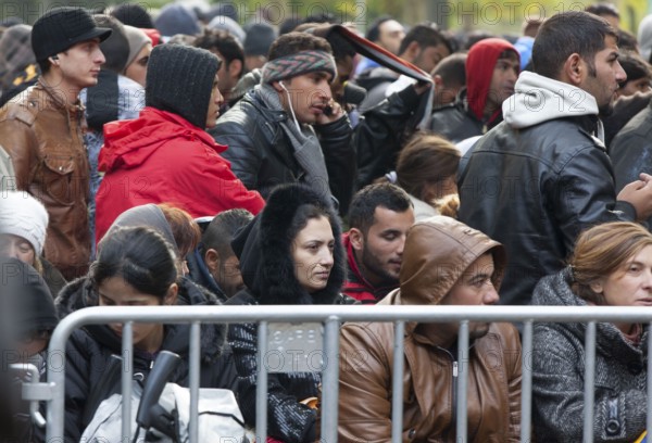 Refugees from Syria waiting to be registered at the Central Reception Centre for Asylum Seekers at