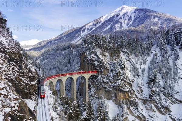 Rhaetian Railway train at the famous Landwasser Viaduct on the Albula railway Stadler Rail