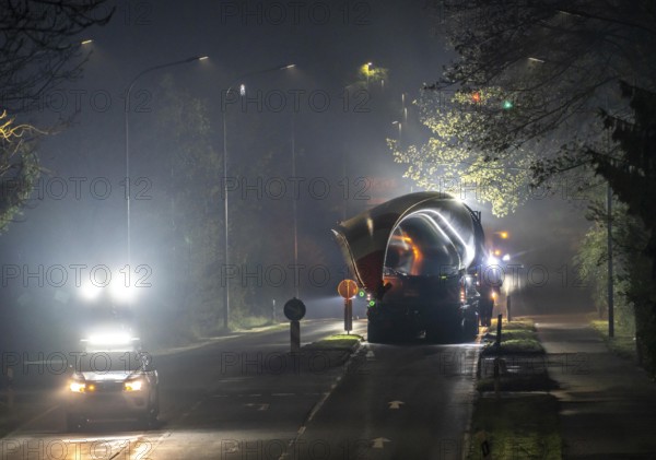 Transport of a 68 metre long, 22 tonne blade of a wind turbine, here in Breckerfeld, with a