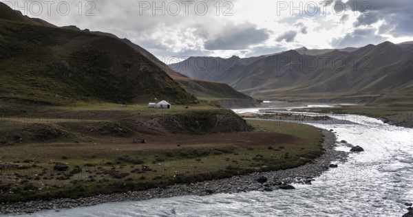 Yurt by a river, Desolate mountain landscape, Tian Shan, Sky Mountains, Sary Jaz Valley,