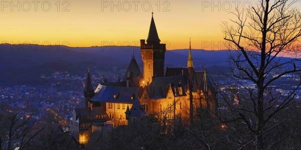 Atmospheric view of the illuminated Wernigerode Castle at sunset, Harz Mountains, Saxony-Anhalt,