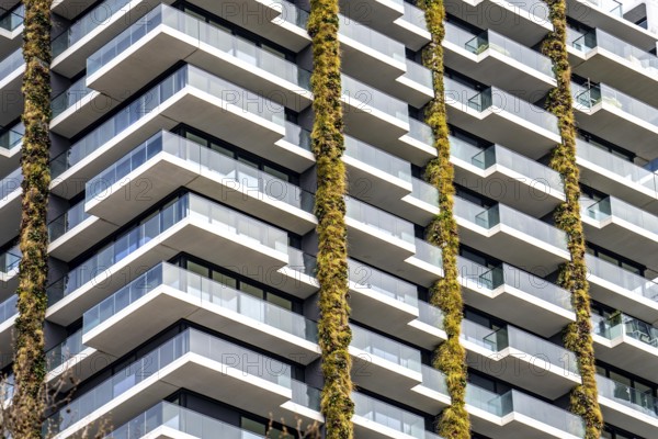 Facade of the Eden Tower on Europa-Allee in Frankfurt am Main, green facade, residential building,