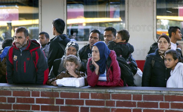 Syrian refugees arrive at Schönefeld station on a special train. They are then taken by bus to