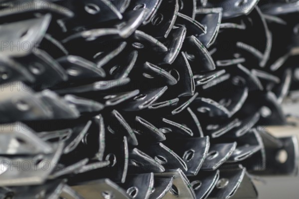 Finished galvanised steel parts lie in the factory hall of the surface finishing company Coatinc