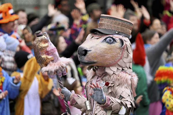 Person masked as a horse with a hat at the carnival parade of the Wey guild on Rose Monday,