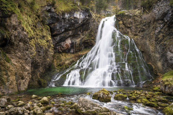 The Golling waterfall (Schwarzbachfall, Schwarzenbachfall) in autumn. Rocks with moss. Tennengau,