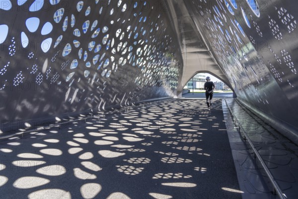 Light effects from the sun in the Parkbruk, a cycle and pedestrian bridge in the city centre of