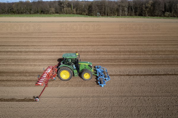 Sugar beet being sown in spring, precision sowing with precision seed drill, behind a tractor,