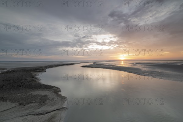 Sunrise off the monastery island of Mont Saint Michel in the Wadden Sea, Le Mont Saint Michel,