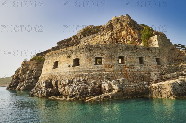Historic rock fortress on the edge of the sea under a clear blue sky, Venetian sea fortress, Leper