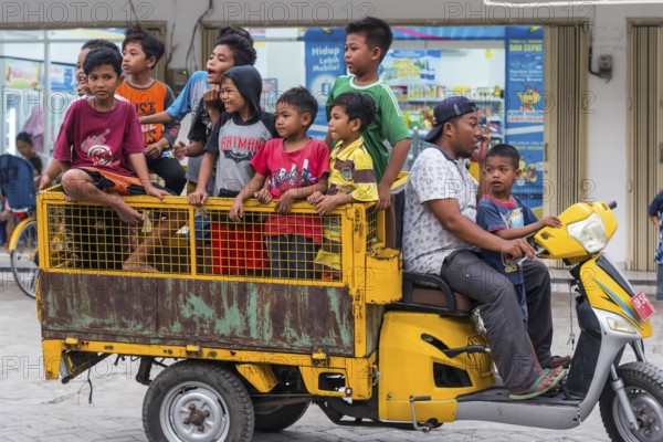 Children on a vehicle in an Indonesian village, village, child, boy, curious, curiosity, childhood,