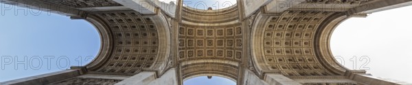 Panoramic view of the interior of the Arc de Triomphe with impressive symmetry, Paris