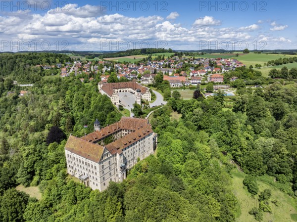 Aerial view of Heiligenberg Castle, a Renaissance-style castle complex, behind it the municipality