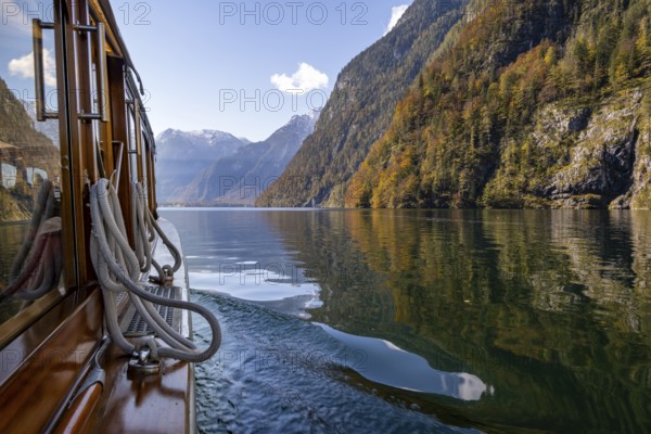 Tourist boat on the Königssee, autumnal mountain landscape reflected in the lake, Berchtesgaden