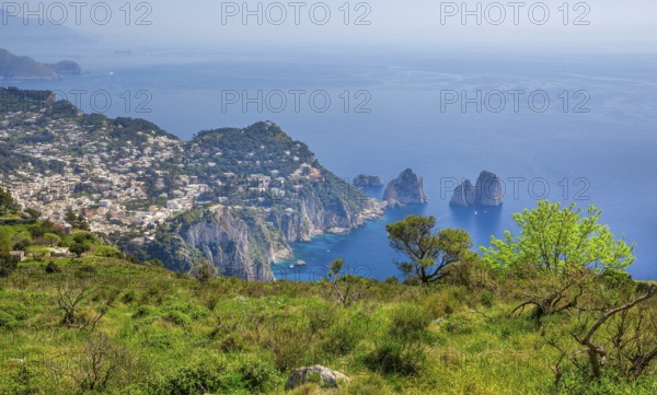View from Monte Solaro 589m to the south coast with the Faraglioni rocks, the island's landmarks,
