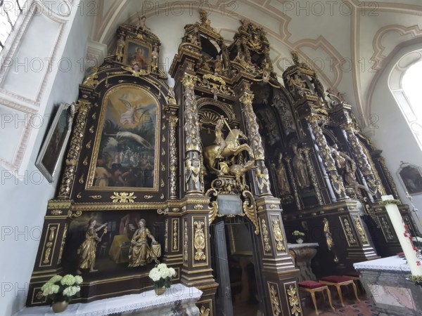 Altar wall, votive pictures, votive tablets on the walls of the Chapel of Grace inside the church,