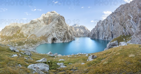 Turquoise mountain lake Kol Suu with rocky steep mountains, Kol Suu Lake, Sary Beles Mountains,