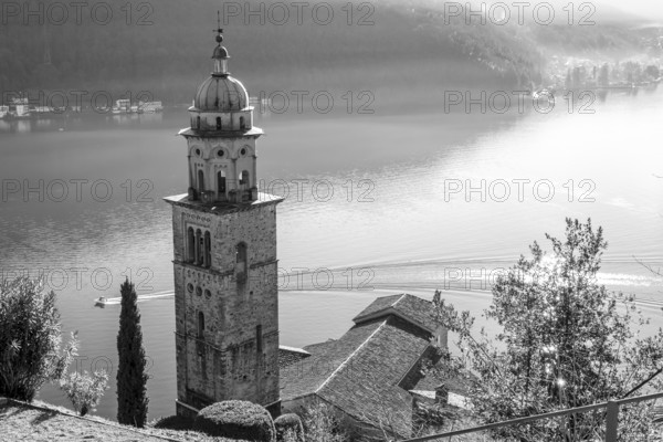 Church Tower Santa Maria del Sasso with Sunlight and Mountain on Lake Lugano in Morcote, Ticino in